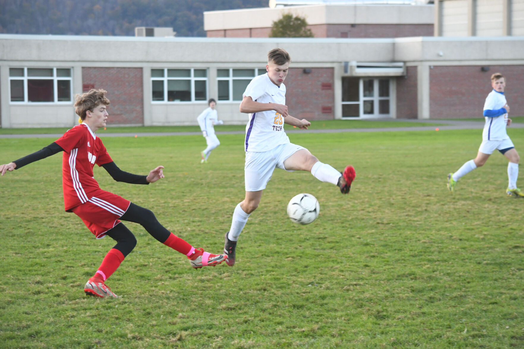 Two players battle for the ball